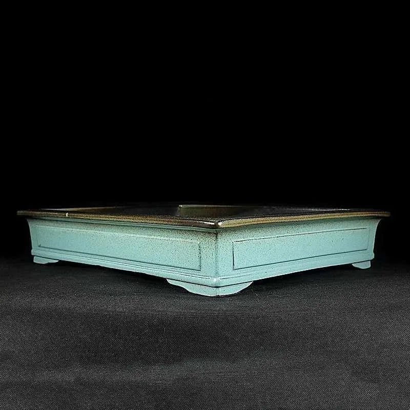 Green retro ceramic bonsai flower pot with handmade purple sand crackle glaze.