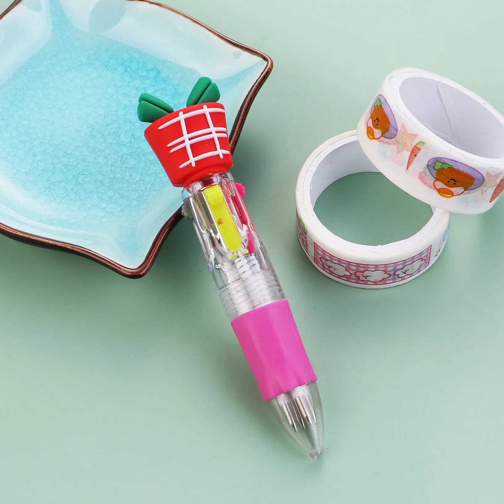 Compact 11cm Christmas-themed press-action ballpoint pen with festive designs.
