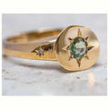 Golden adjustable ring with oval zircon centrepiece and star pattern detail