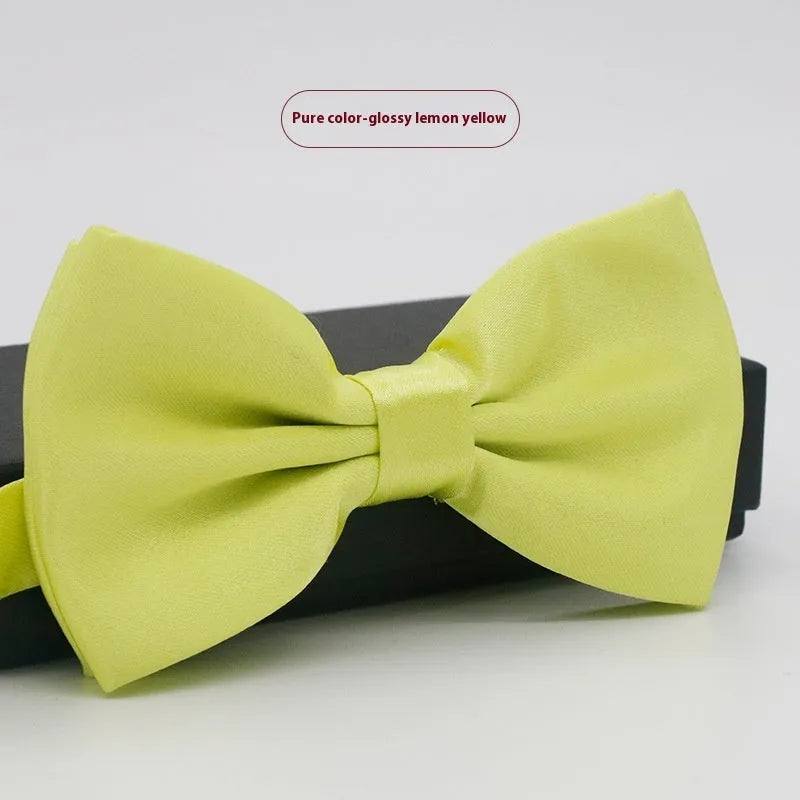 Solid colour polyester bow tie with flat head design measuring 12cm by 6cm