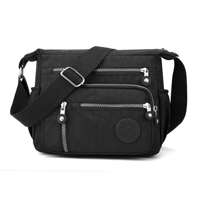 Soft nylon large capacity square messenger bag in multiple colour options on a single shoulder strap.