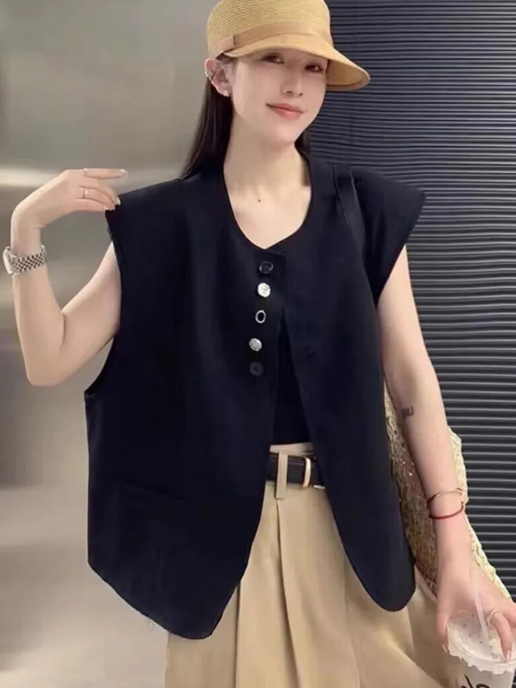 Women's loose fit polyester vest in milky white, featuring a short length and a front pocket.