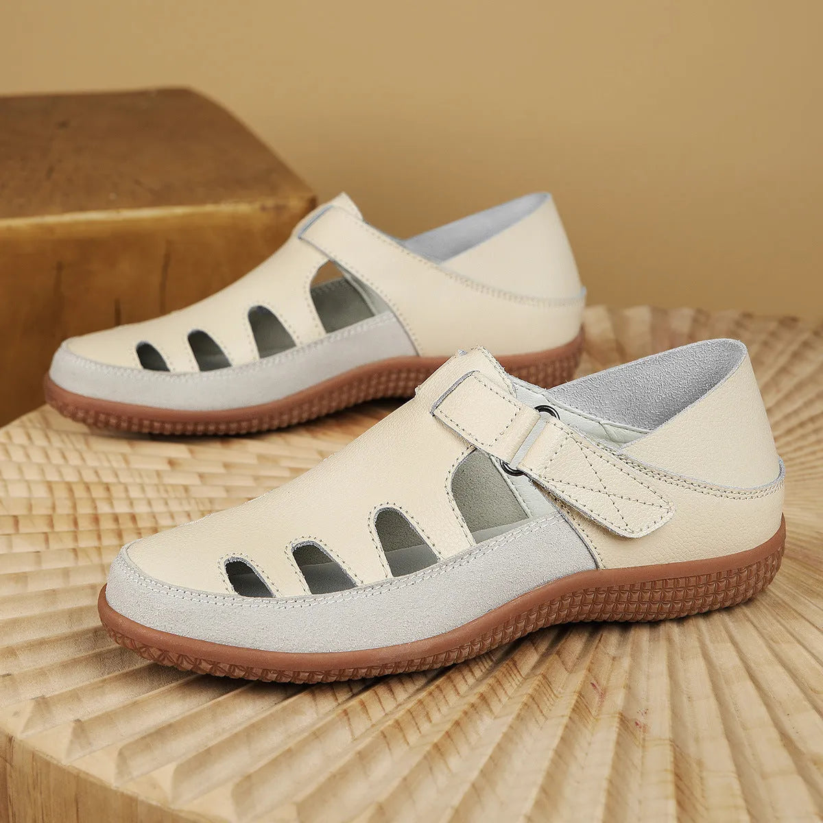 Plus size women's flat sandals with hollow-out design and toe cap in blue, red, or white.