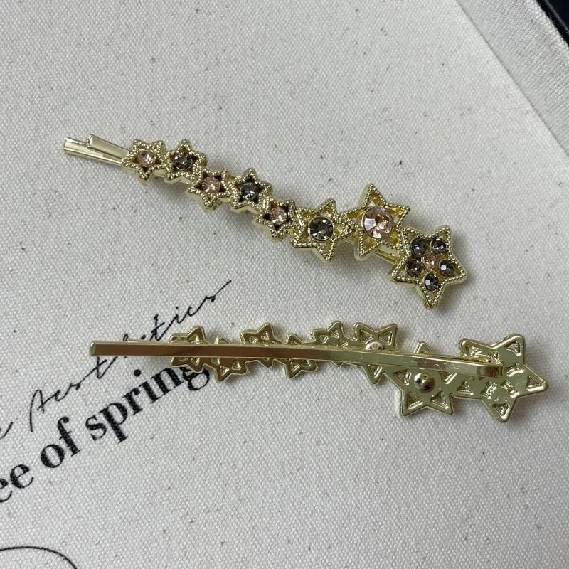 Golden electroplated hair barrette with star decoration and side clip design for bangs