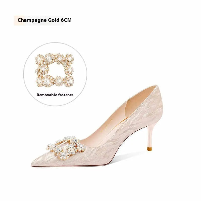 Champagne gold women's high heel pumps with pointed toe and stiletto heel on a plain background.