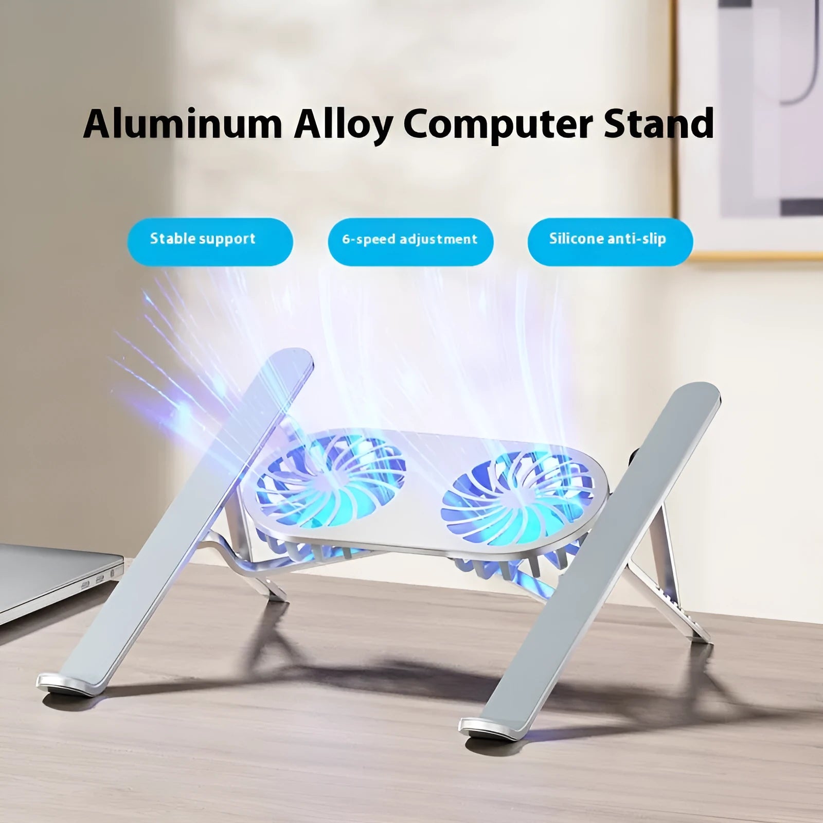 Silver aluminium laptop cooling stand with twin fans and adjustable height mechanism, folded beside notebook computer