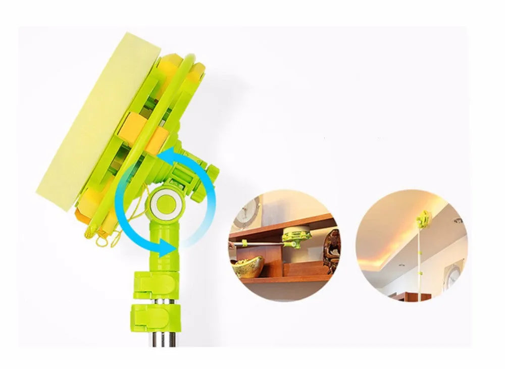 Green telescopic glass wiper with extendable handle resting on a windowsill