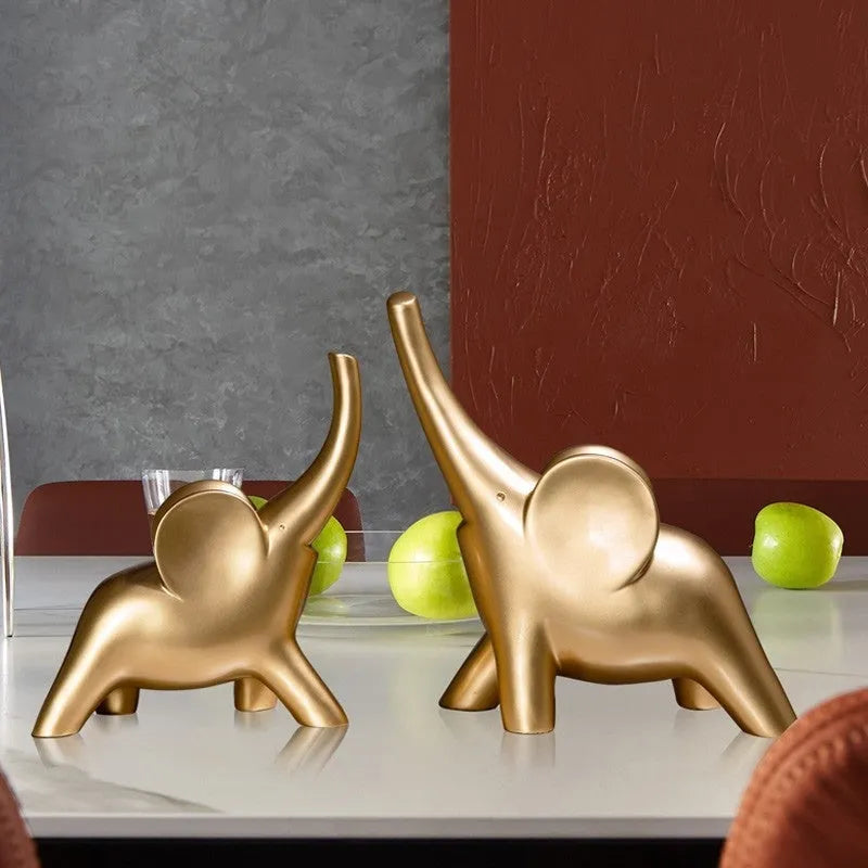 Minimalist solid resin elephant ornament in rose gold on a shelf.