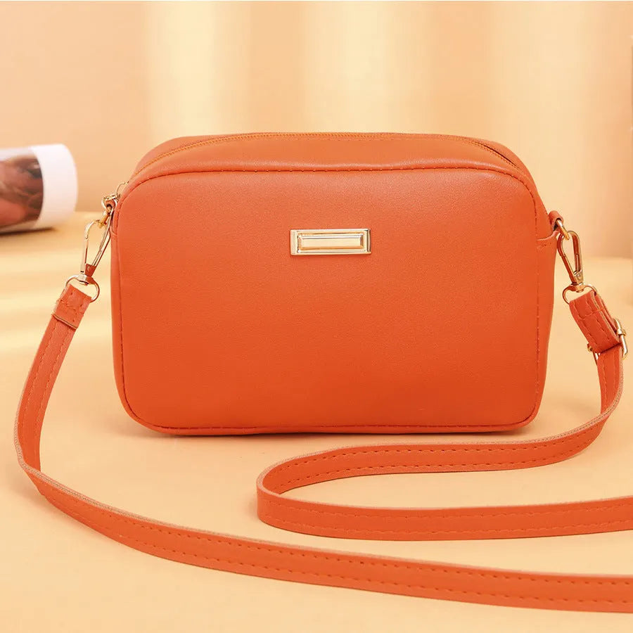 Solid colour women's PU shoulder bag with three-dimensional pocket design in urban simple style