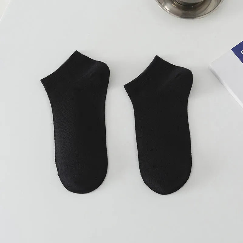 Men's low-cut solid colour boat socks made from breathable polyester, shown in one of six available colour options.