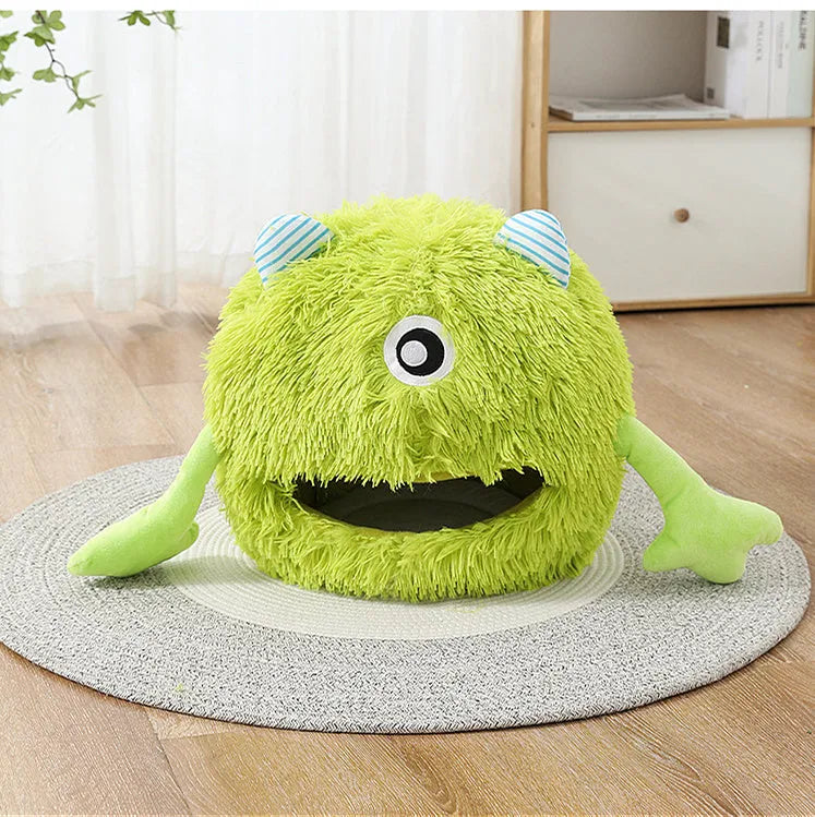 Round fluffy plush cat bed on a floor, showing its non-slip base, next to a resting cat.