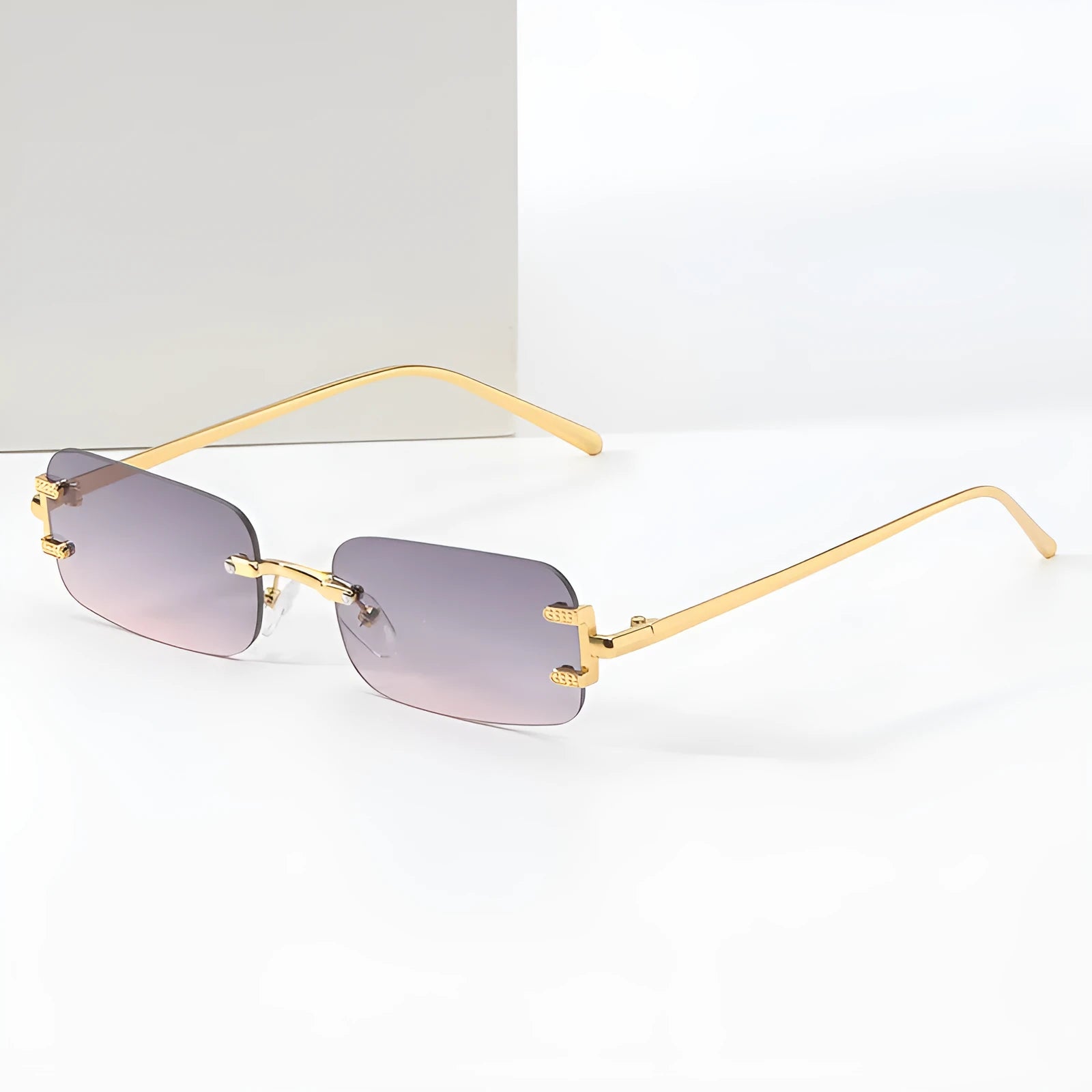 Retro square frameless sunglasses with gold metal frame and black/grey AC lenses