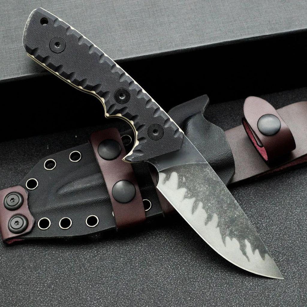 Portable camping knife with black handle and 100mm blade on plain background