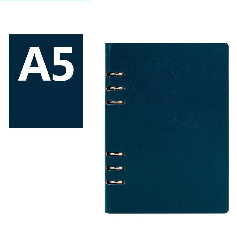 Simple business notebook with imitation leather cover showing loose-leaf binding and beige road forest paper