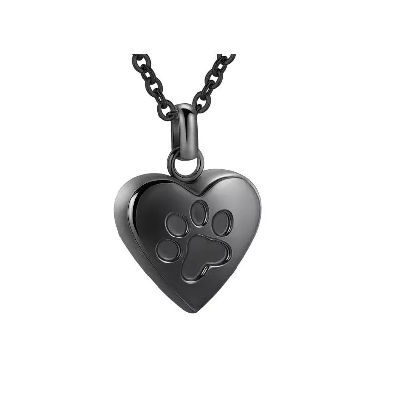 Openable heart-shaped cinerary casket necklace with paw print, made from polished titanium steel.