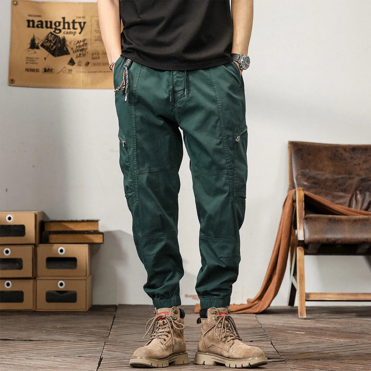 Men's loose fit cotton trousers with tapered ankle banded legs in khaki colour.