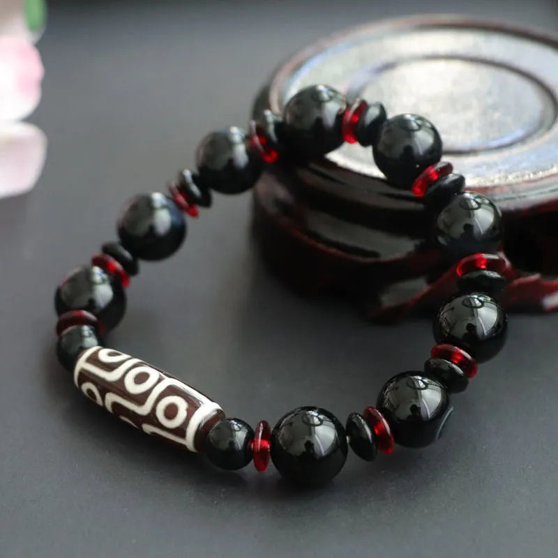 Black agate Dzi bead bracelet with hand-woven geometric pattern in national style design