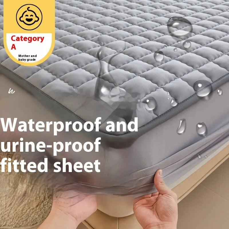 Blue washed cotton fitted sheet with quilted pattern on a bed, showcasing its waterproof protection feature.