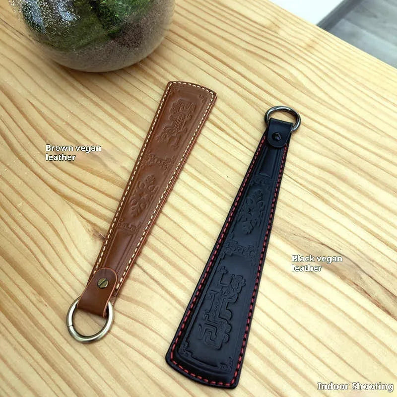 Pat massage anti-body skin racket with thick vegetable tanned leather and stainless steel panel, 25.5cm length, black colour