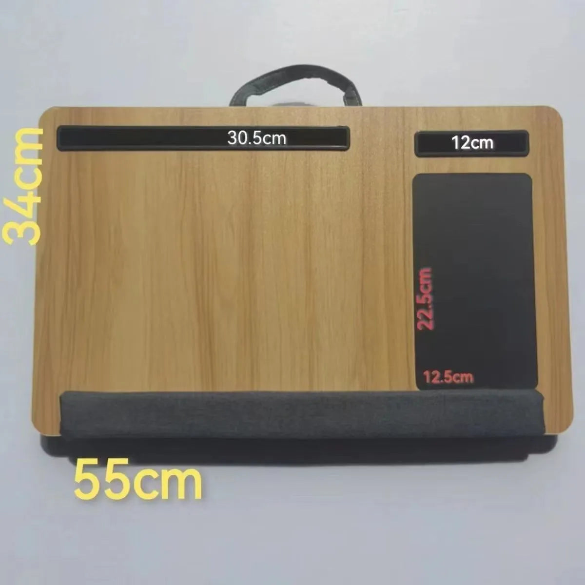 Foldable laptop desk in black walnut colour on a bed with laptop open