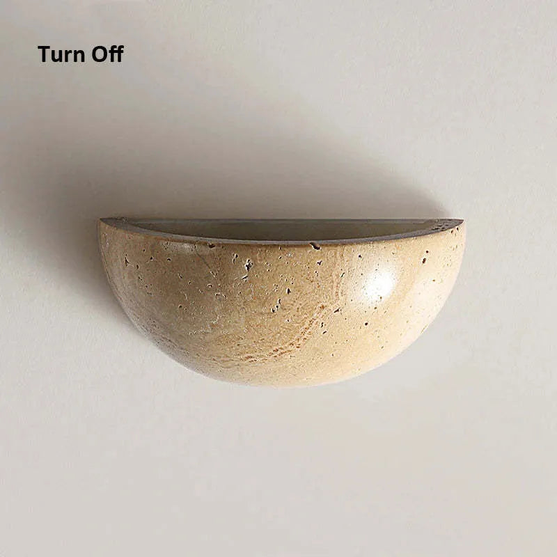 Retro marble semicircle wall lamp with adjustable LED light on a stone wall