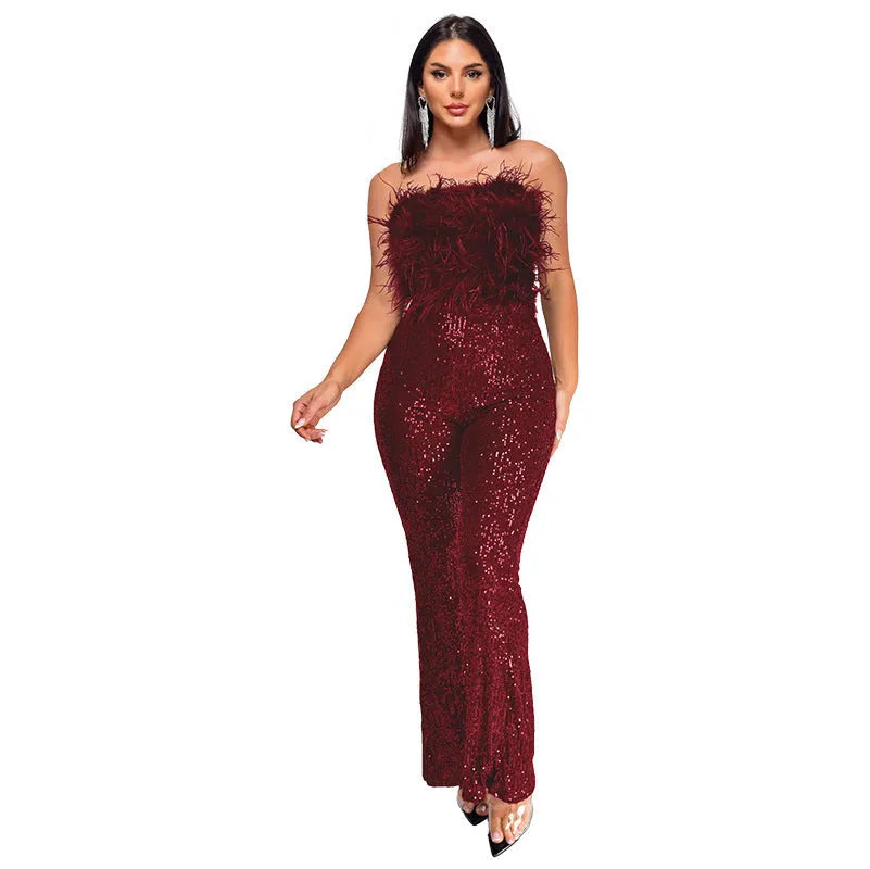 Women's sleeveless backless jumpsuit with flared legs in a champagne colour on a mannequin.