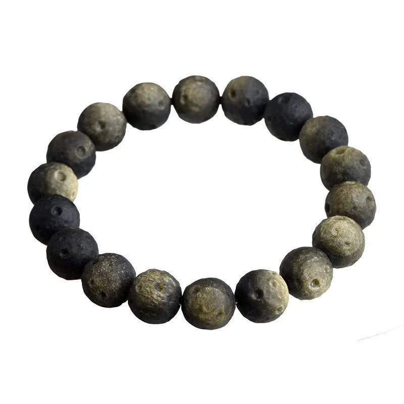 Natural obsidian crater ball bracelet with polished beads in silver or golden meteorite colours