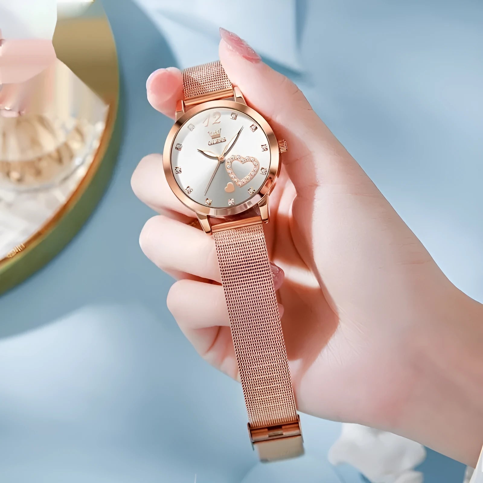 Women's fashion watch with rose alloy case and mesh strap in six dial colour options.