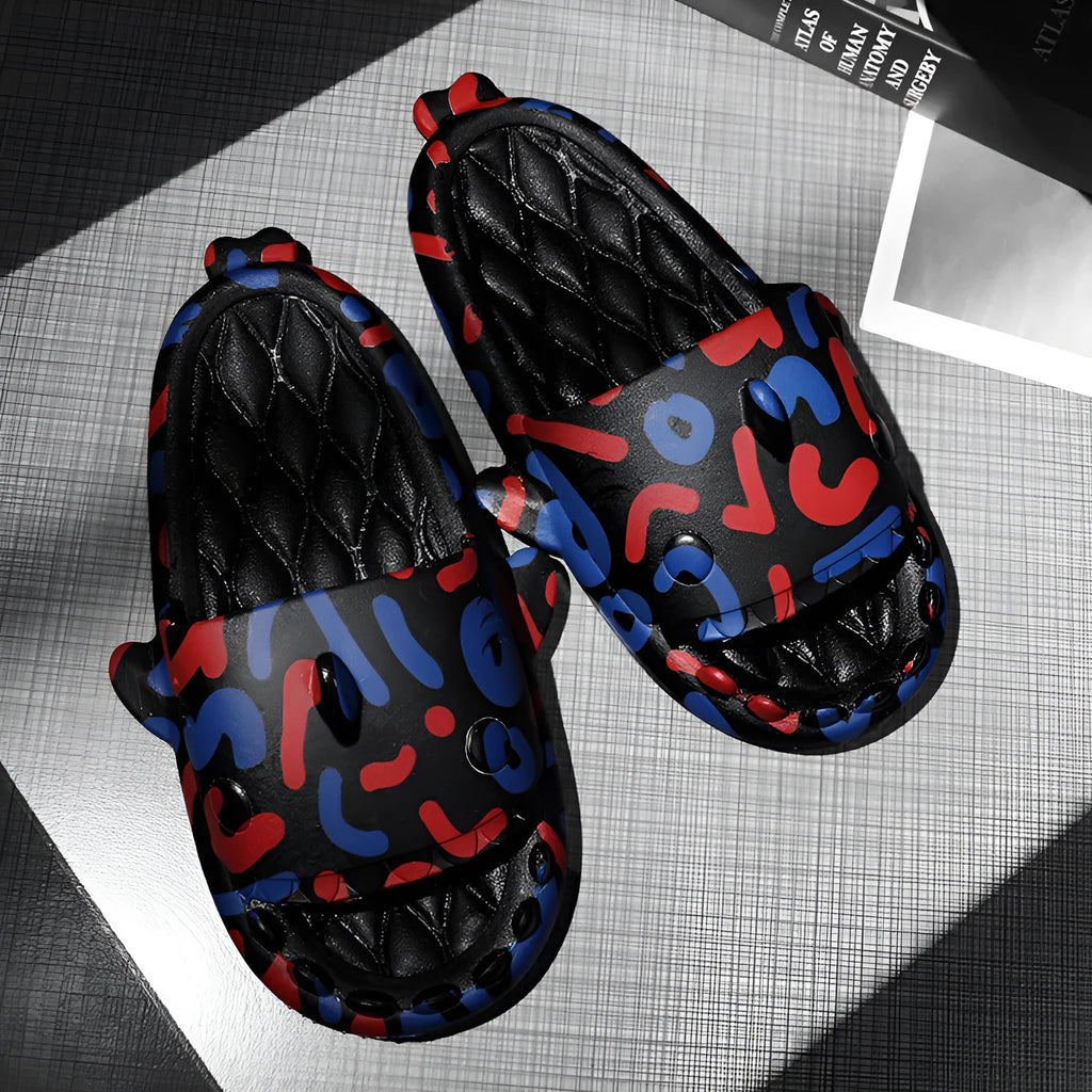 Beige and black EVA open-toe home slippers with a shark design on the front, shown as a couple's pair.