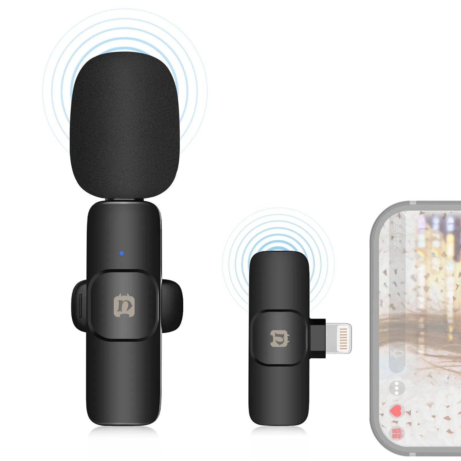 Wireless carbon fibre neckline clip microphone transmitter on a black background with storage box and accessories