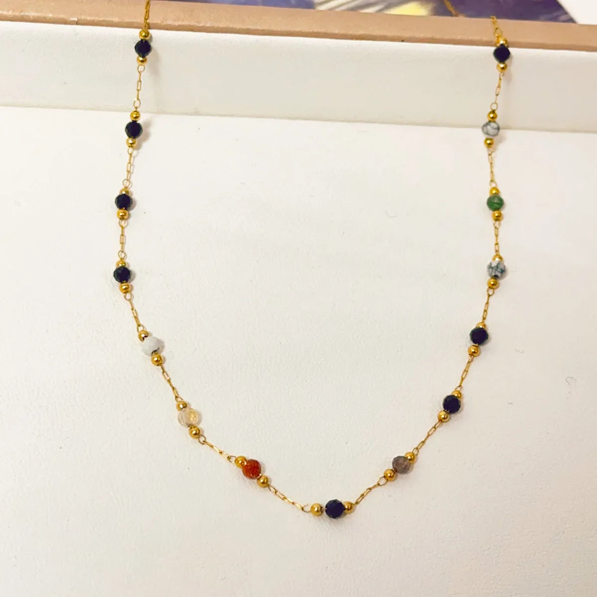 Gold titanium steel women's necklace with natural stone pendant and O-ring chain in retro simple style