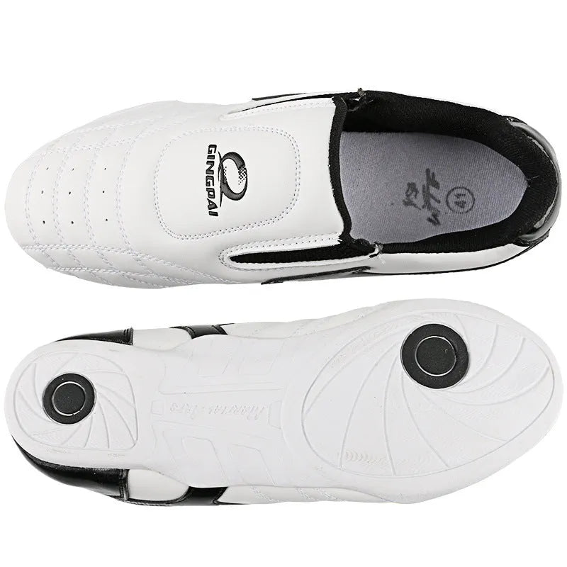 Black and white PU Taekwondo martial arts training shoes with a soft sole.