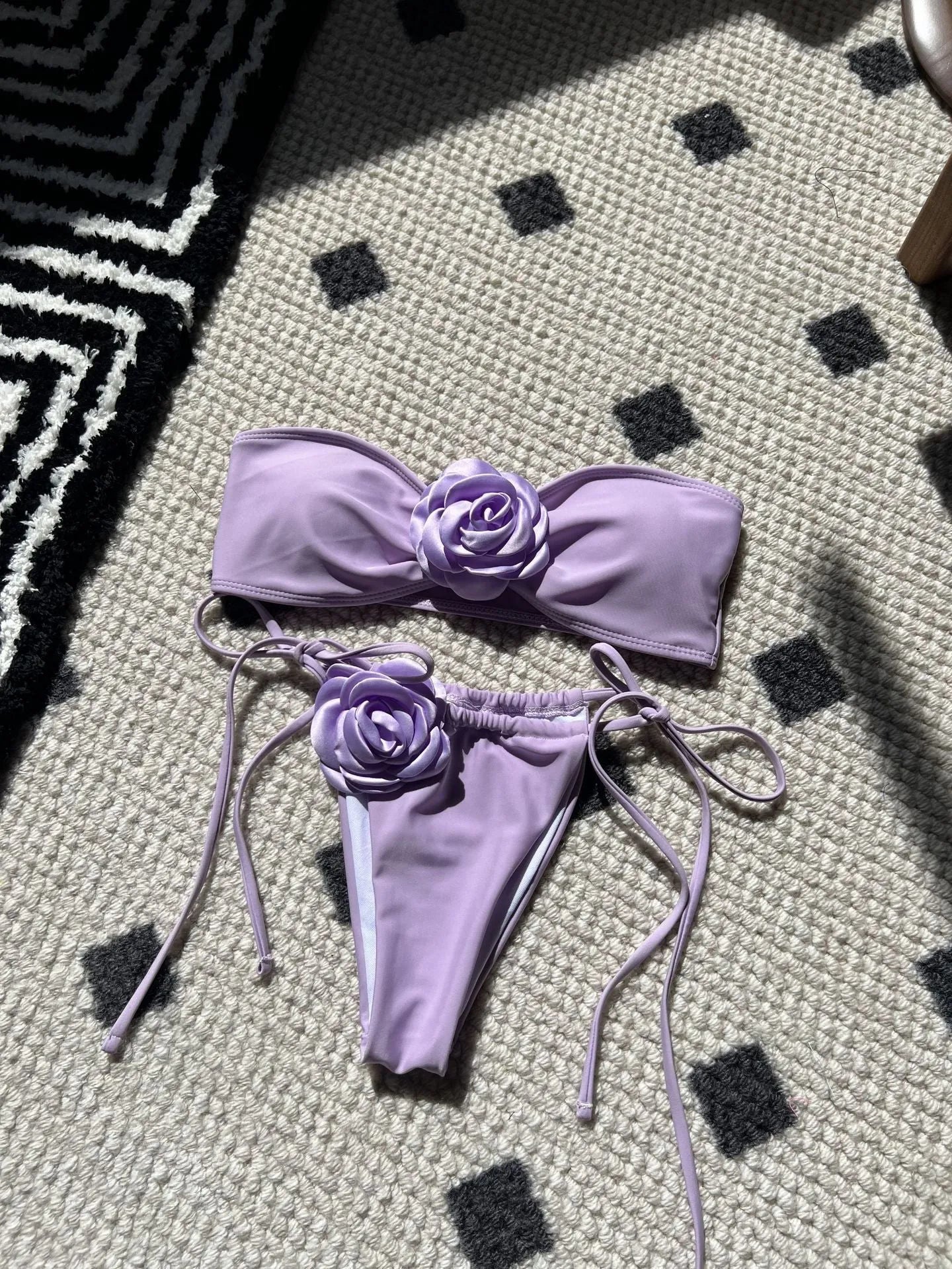 Women's solid colour drawstring tube top and bikini brief swimsuit set on a mannequin.