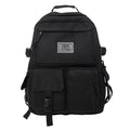 Black nylon student backpack showing laptop compartment and three-dimensional pockets