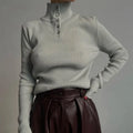 Women's silver grey half turtleneck pullover sweater with a single-breasted placket front.