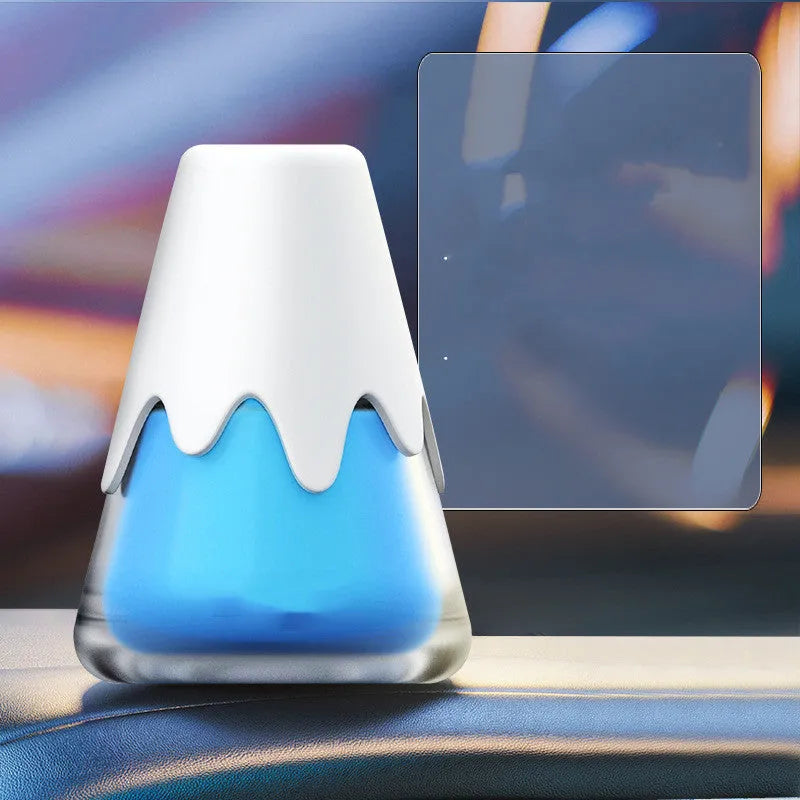 Snow Mountain Cup car air freshener in glass paste case showing four colour and scent options.