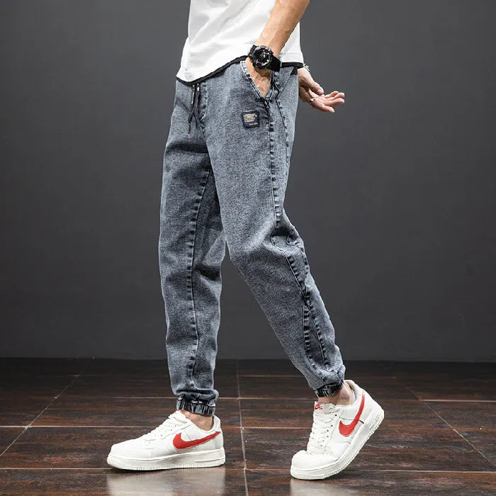 Men's cropped oversized slimming straight leg jeans in black, grey, and blue with high elasticity cotton blend