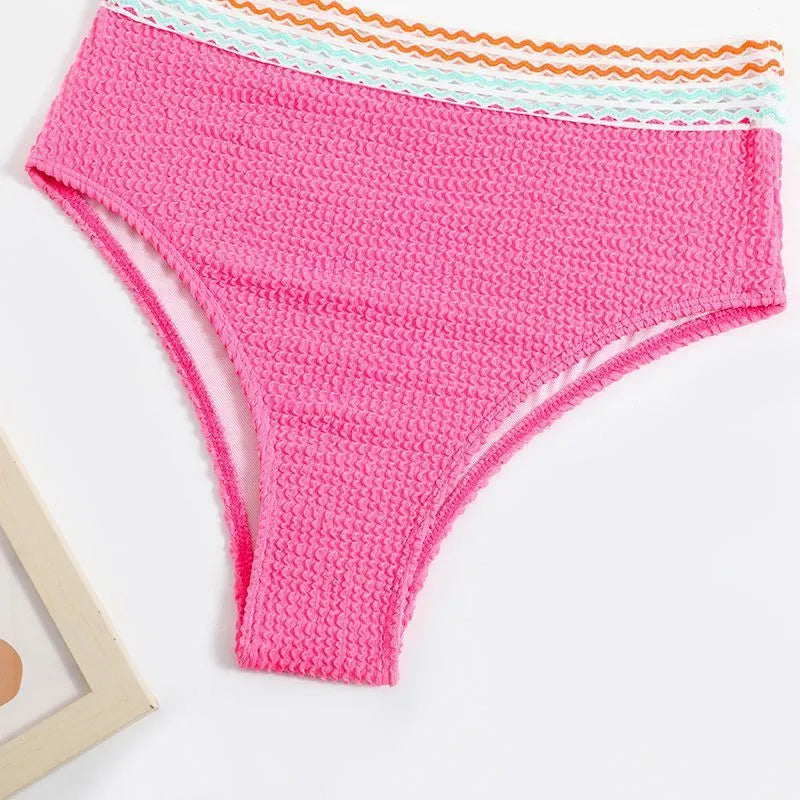Women's high waist bikini set in solid pink colour, made from nylon fabric.