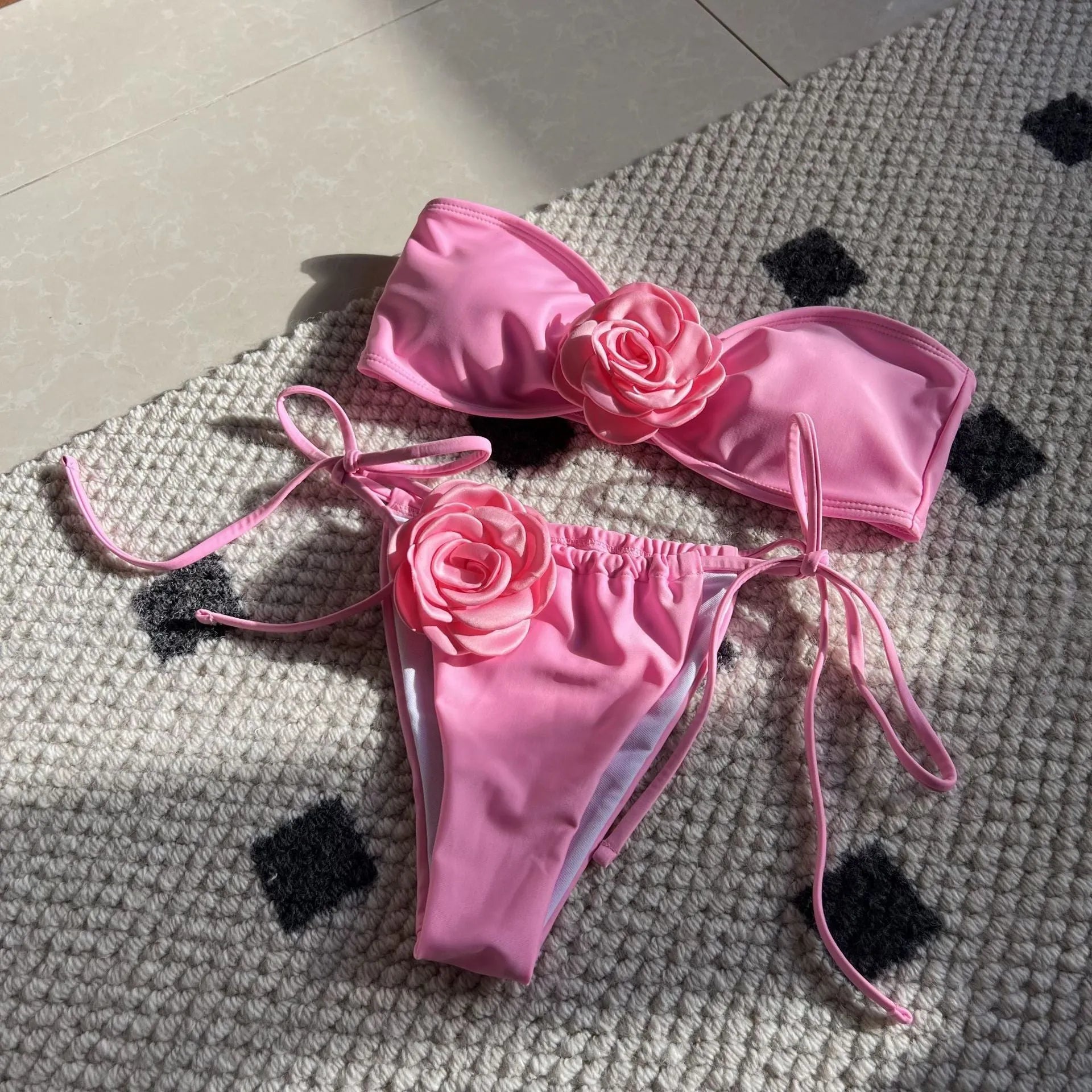 Women's solid colour drawstring tube top and bikini brief swimsuit set on a mannequin.