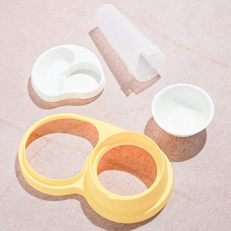 Grey and yellow pet dual feeding bowl with ceramic dish and stainless steel water dispenser on non-slip base