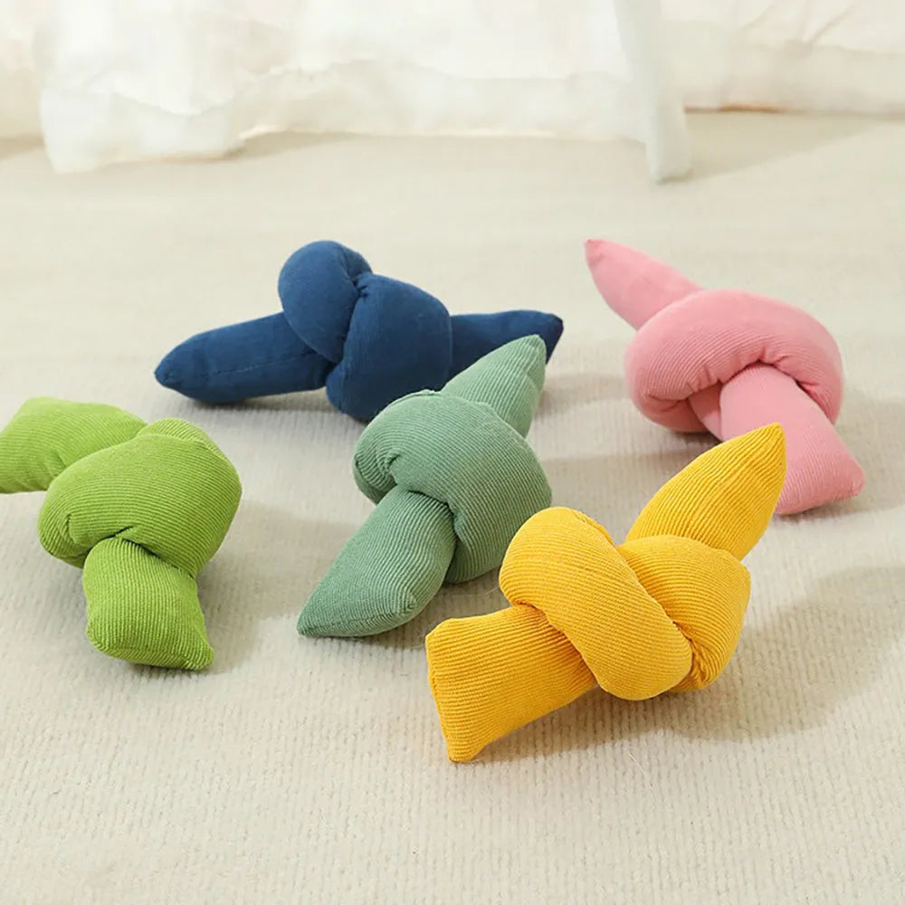 White knotted cotton dog rope toy for tug of war and chewing.