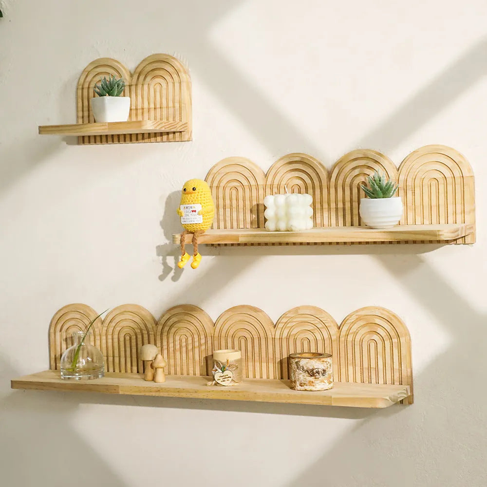 Solid wood multi-tiered wall rack holding several potted plants.