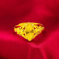 Gold geometric flower ring with open diamond design and textured surface on brass base