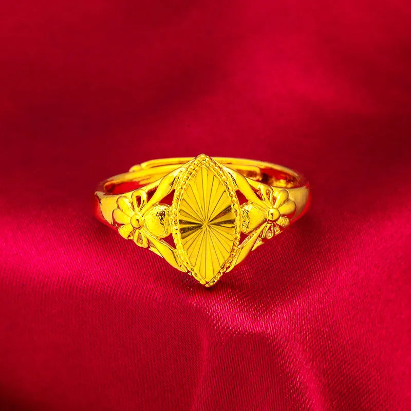 Gold geometric flower ring with open diamond design and textured surface on brass base