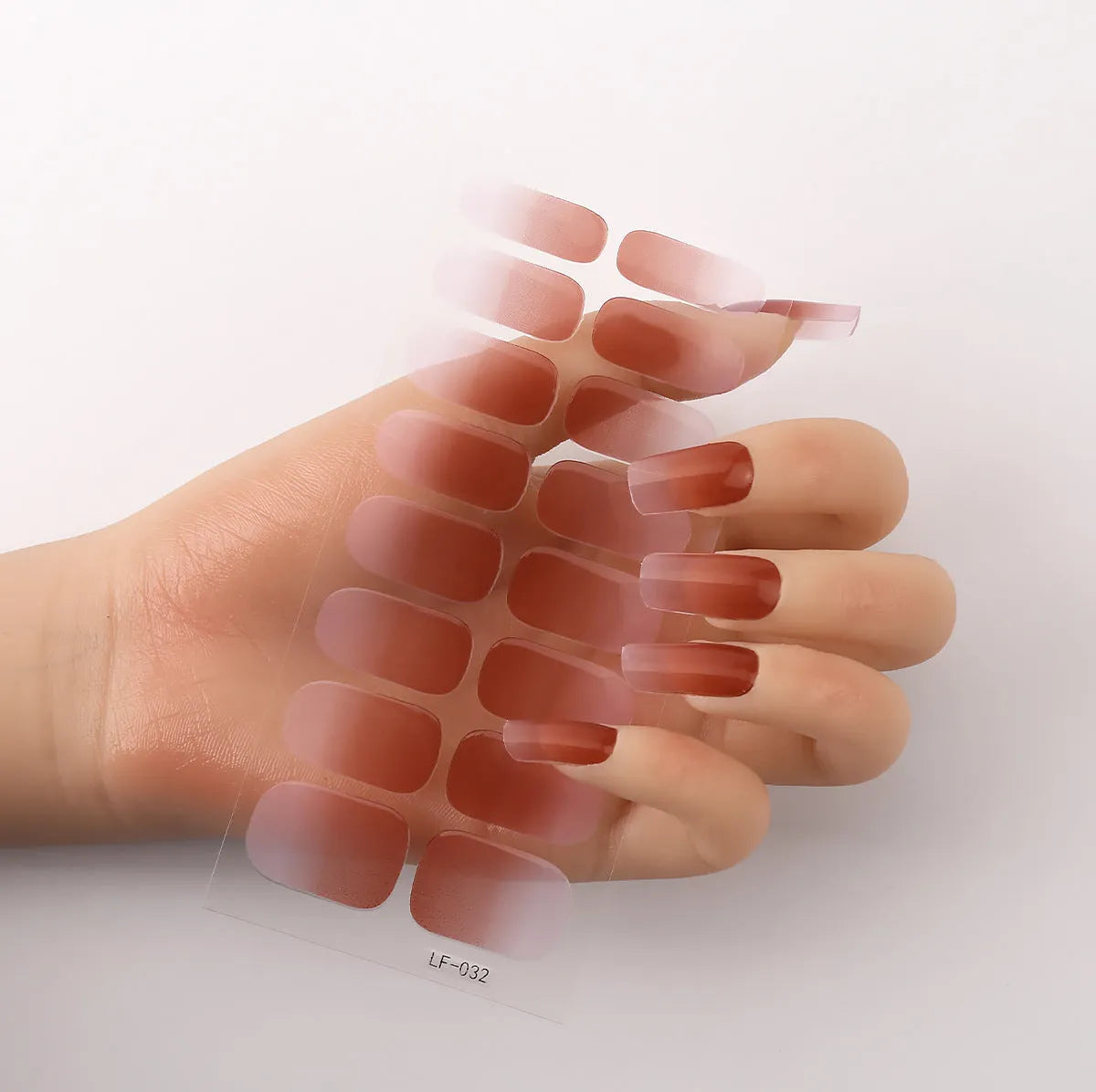 Set of 16 solid colour full nail art stickers showing patterns like cross, rose, tulip, and cartoon designs.
