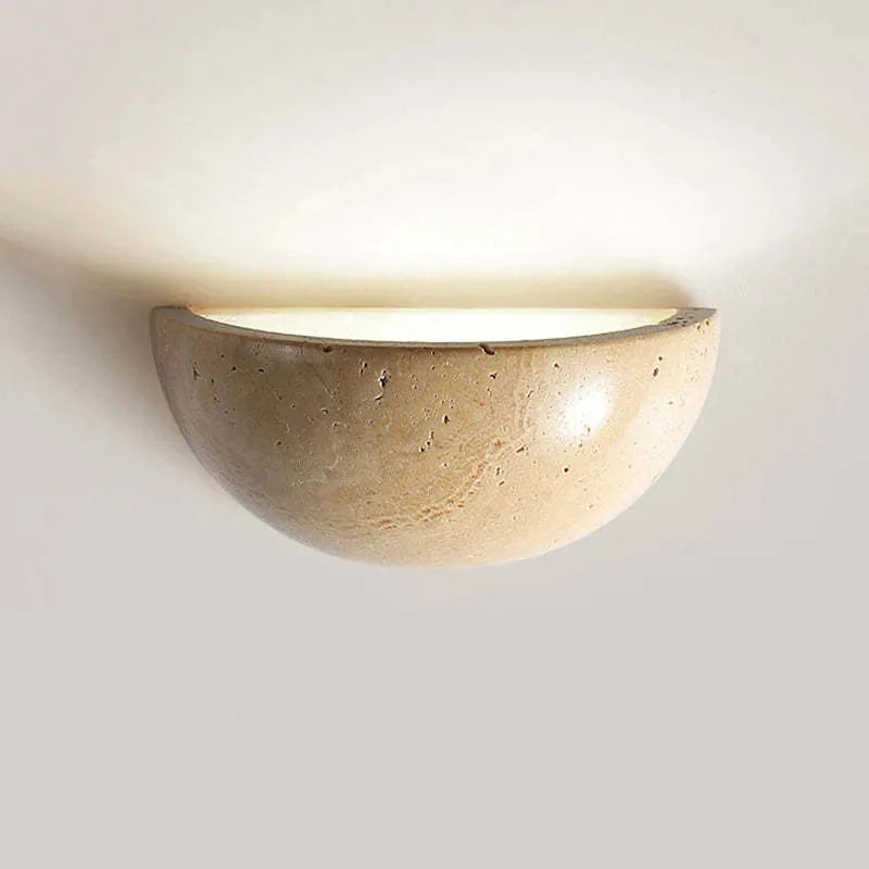Retro marble semicircle wall lamp with adjustable LED light on a stone wall