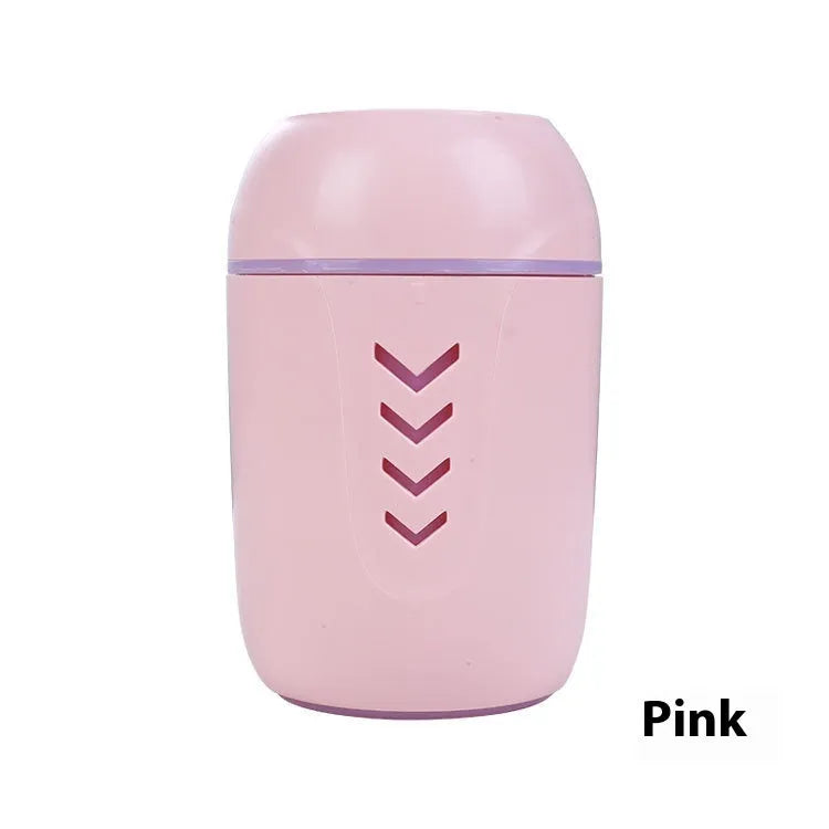 Compact round white portable air purifier with USB cable on a car dashboard and office desk.