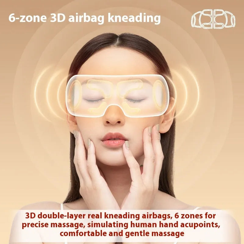 White rechargeable eye massager with hot compress and airbag massage functions on a grey background