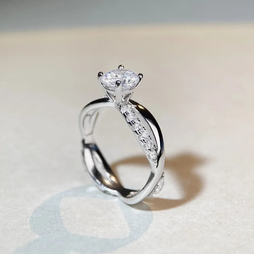 Silver geometric cross ring with 1 karat moissanite centre stone and twisted arm band