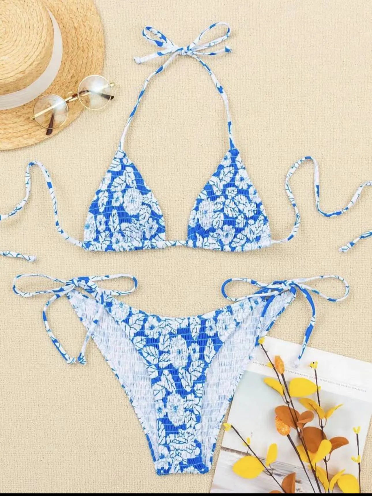 Women's floral patterned halter-neck bikini set in multiple colours on a mannequin
